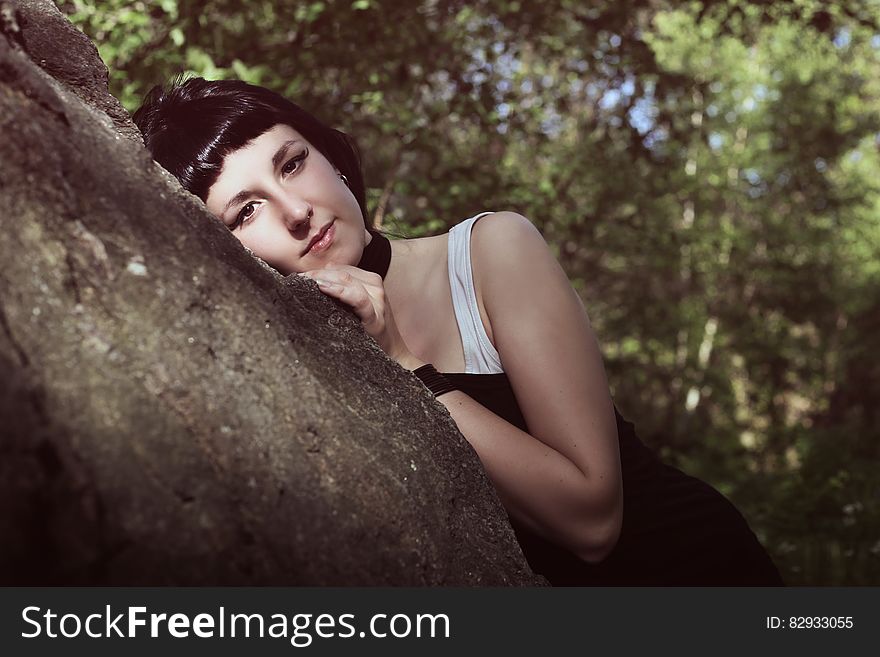 Portrait of woman in tree