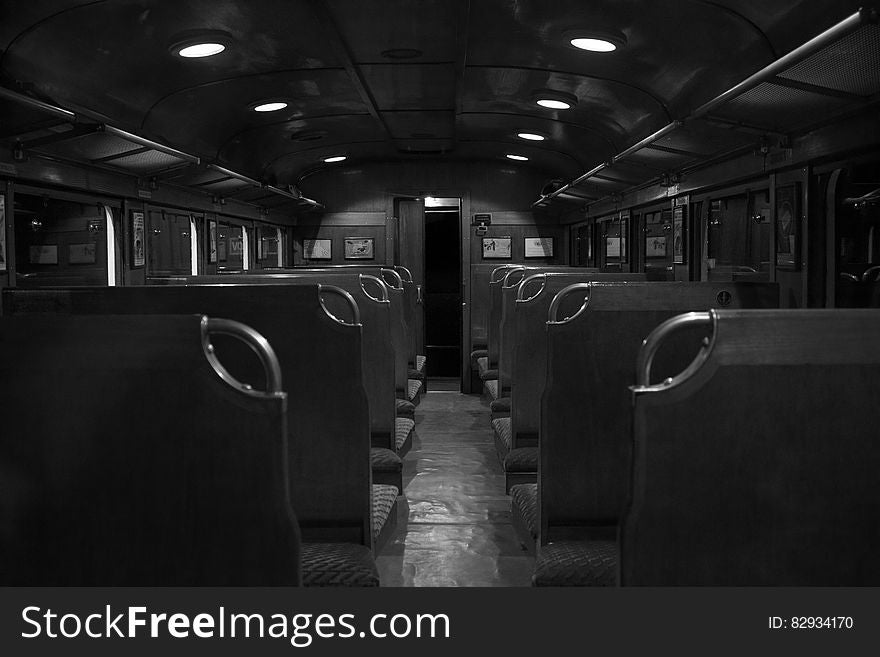 Grayscale Photography of Train Car Interior