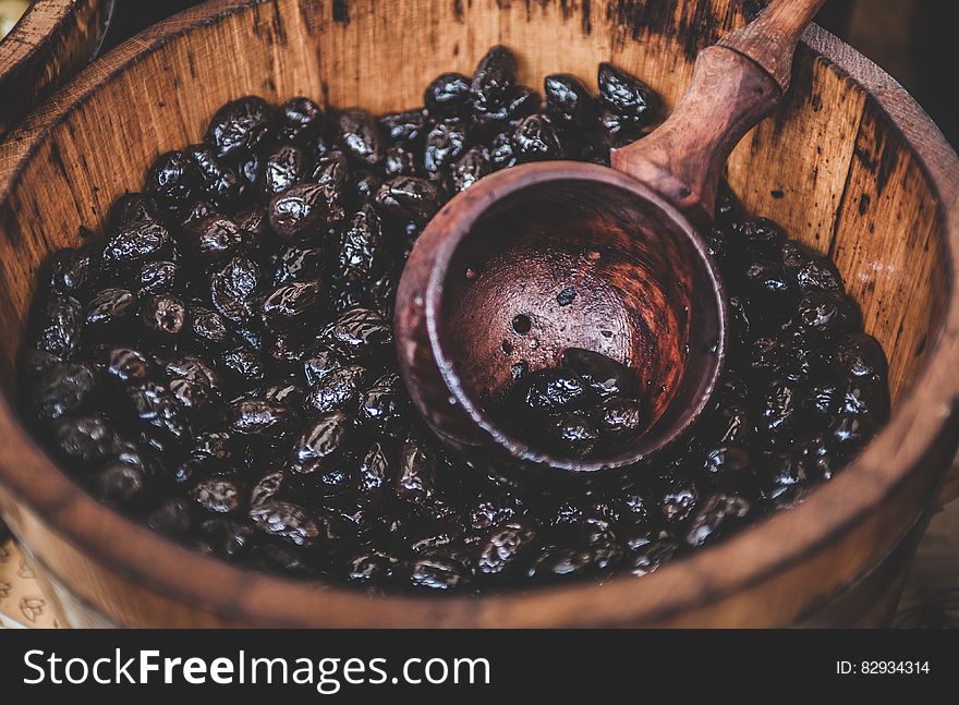 Close Up Photography Of Black Berry In Brown Wooden Container