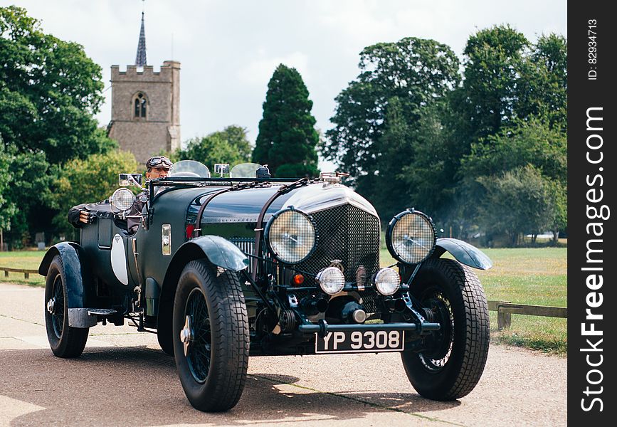 A classic Bentley 3.5 Litre convertible on a road.