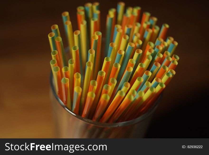 Colorful Plastic Straw on a Glass Container