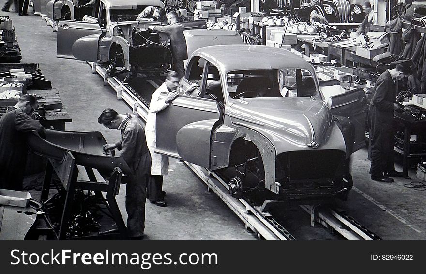 Gray Scale Photo of Car Factory