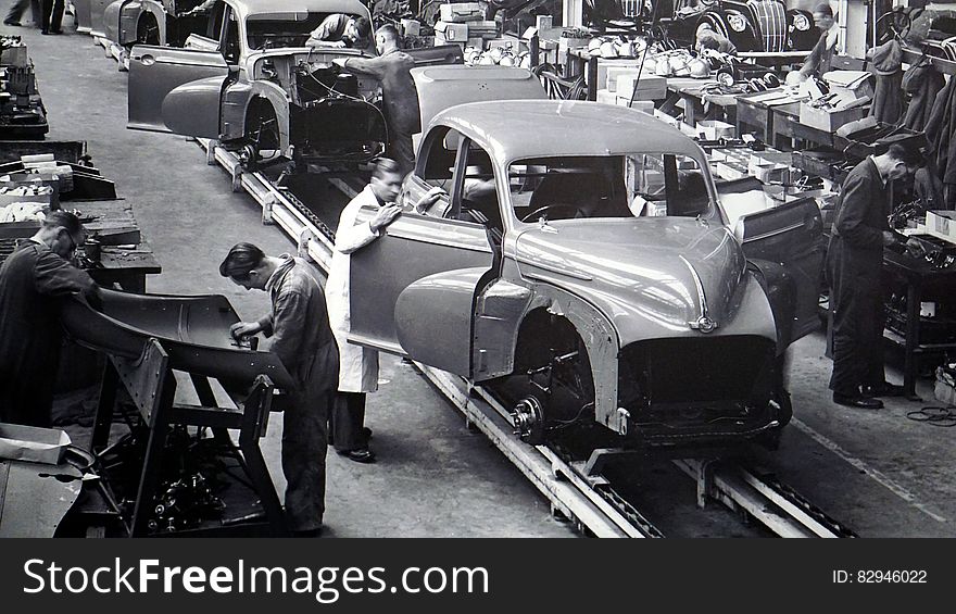 Gray Scale Photo Of Car Factory