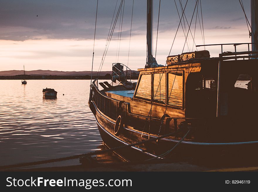 Photo of Ship on Water during Sunset