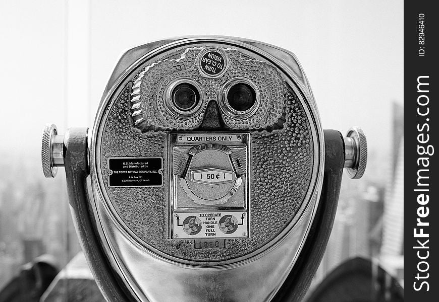 Close up of scenic viewfinder in black and white in urban setting.