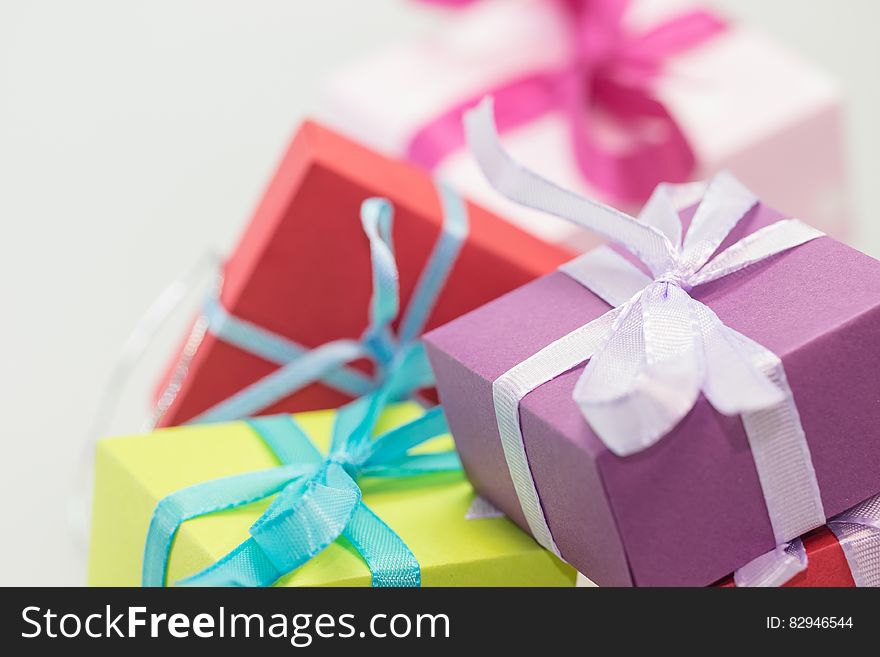 Wrapped pile of Christmas or birthday presents with white background and copy space. Wrapped pile of Christmas or birthday presents with white background and copy space.