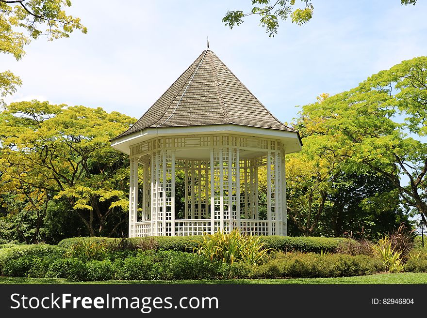 White Wooden Shed in the Middle of the Park during Day Time