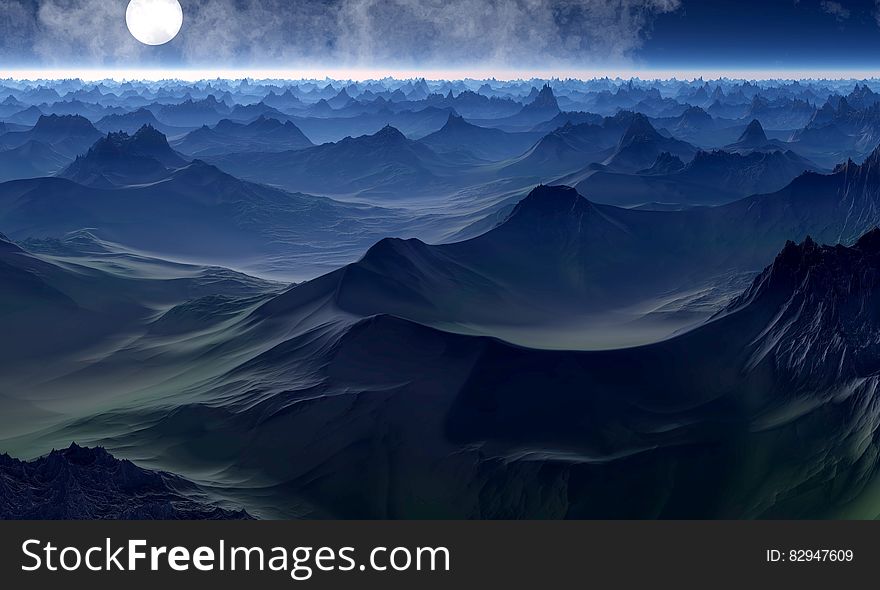 Full moon over hilly landscape