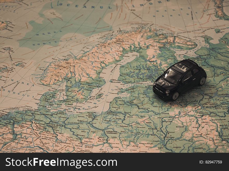 A miniature car over the map of Eastern Europe, Baltic and Russia. A miniature car over the map of Eastern Europe, Baltic and Russia.