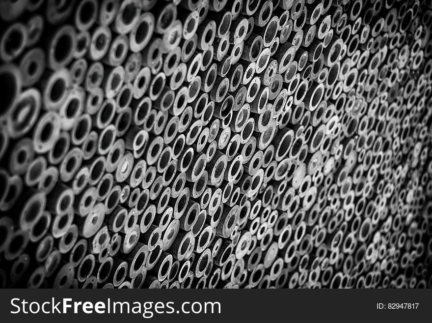 Close up of bamboo poles in abstract black and white background. Close up of bamboo poles in abstract black and white background.
