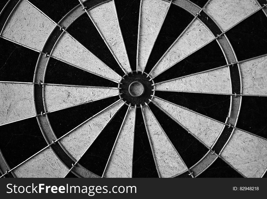 Close up of dart board in black and white.