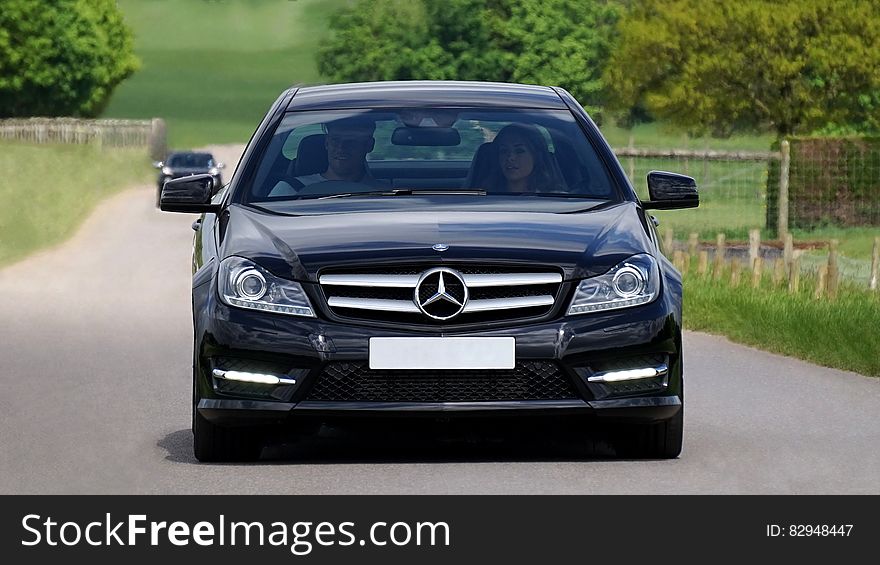 Black Mercedes Benz Car On Grey Asphalt Road During Daytime