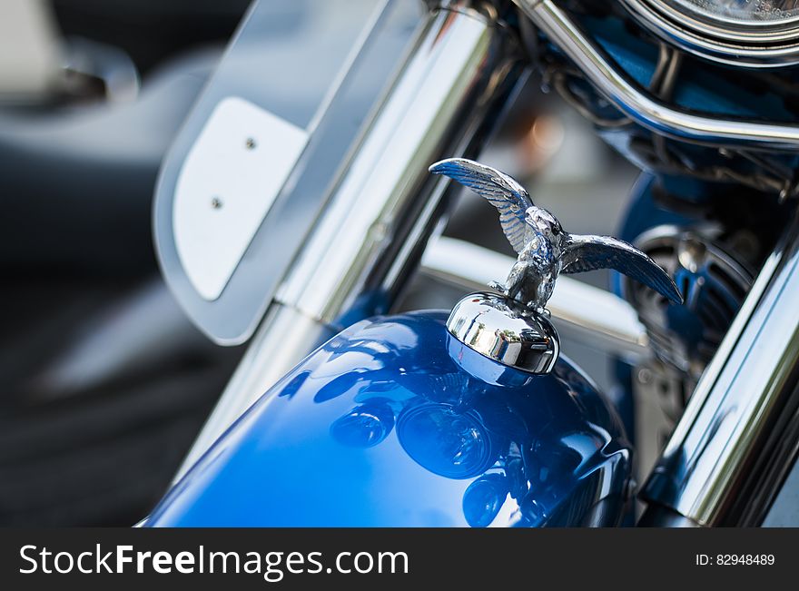 Harley Davidson Emblem on Top Front of Blue Motorcycle