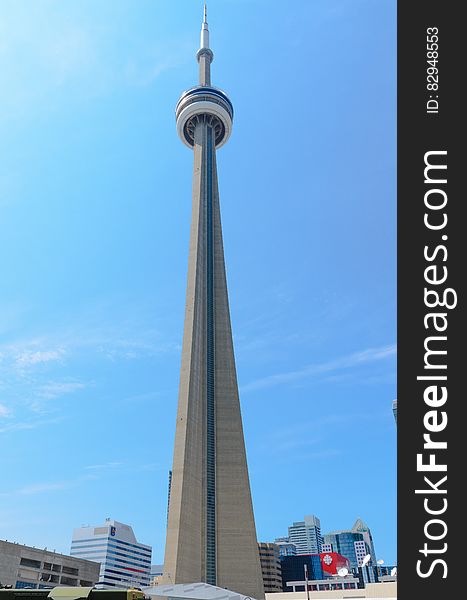 CNN Tower in Toronto, Canada skyline against blue skies on sunny day. CNN Tower in Toronto, Canada skyline against blue skies on sunny day.