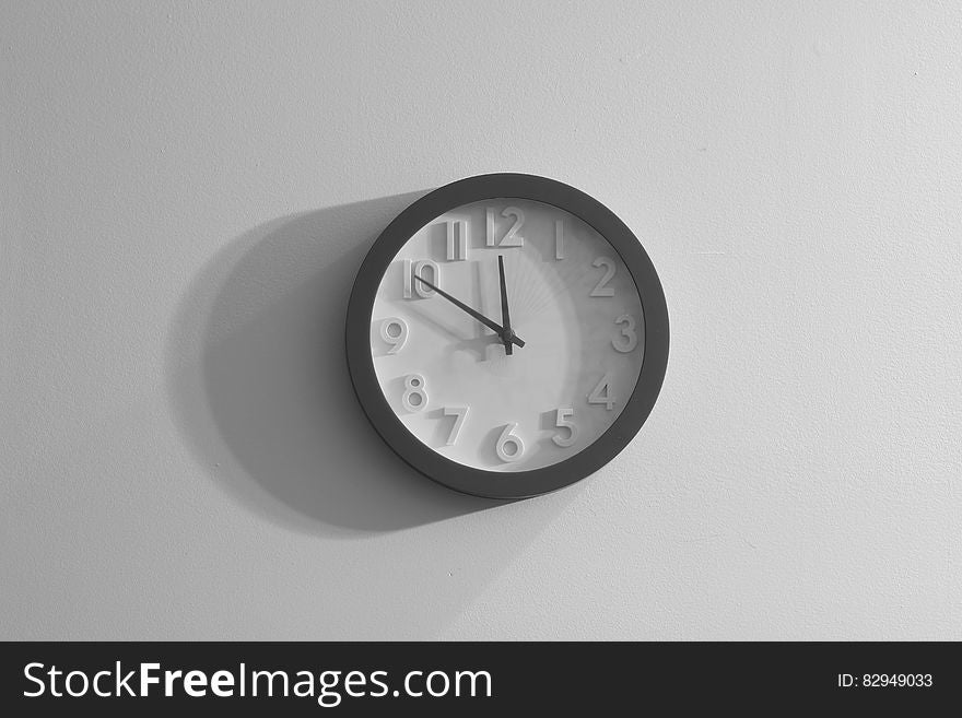 Black and white clock on the wall.