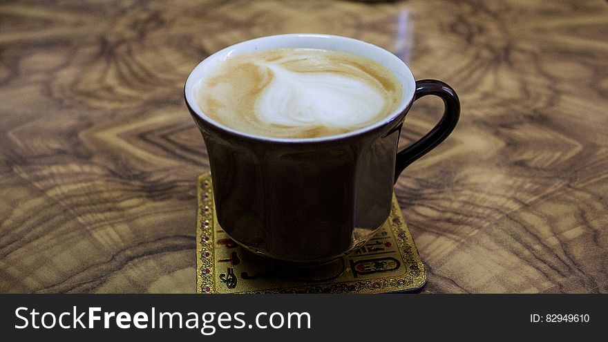 Cappuccino On Black Ceramic Mug