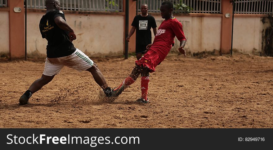 2 Soccer Player Playing For A Ball