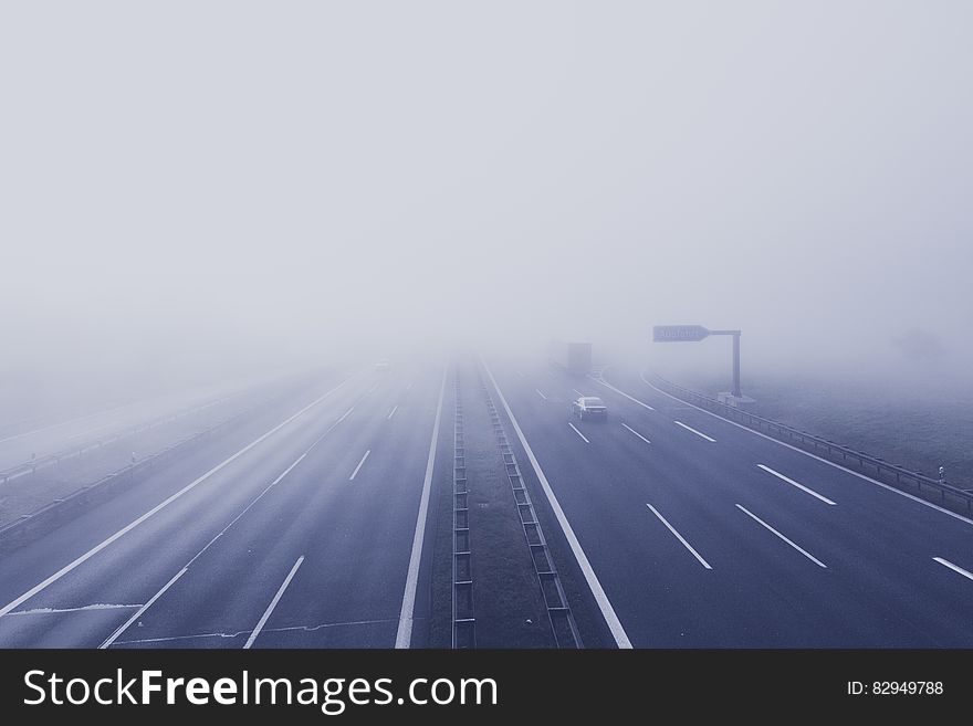 Black Car on Hi-way With Fog