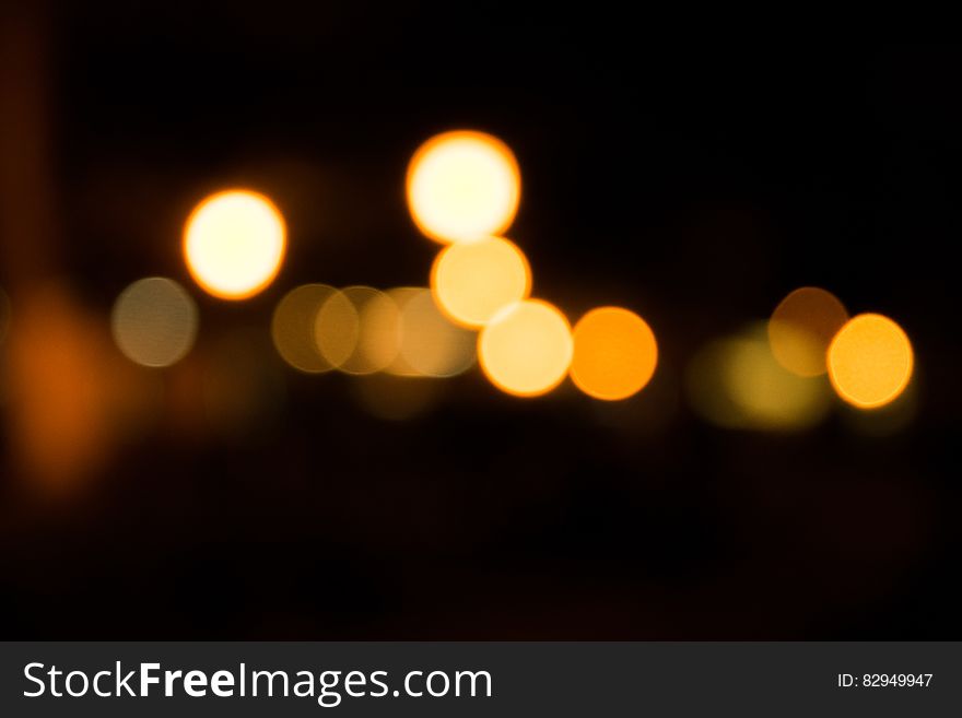 Abstract background blur of bokeh lights at night.