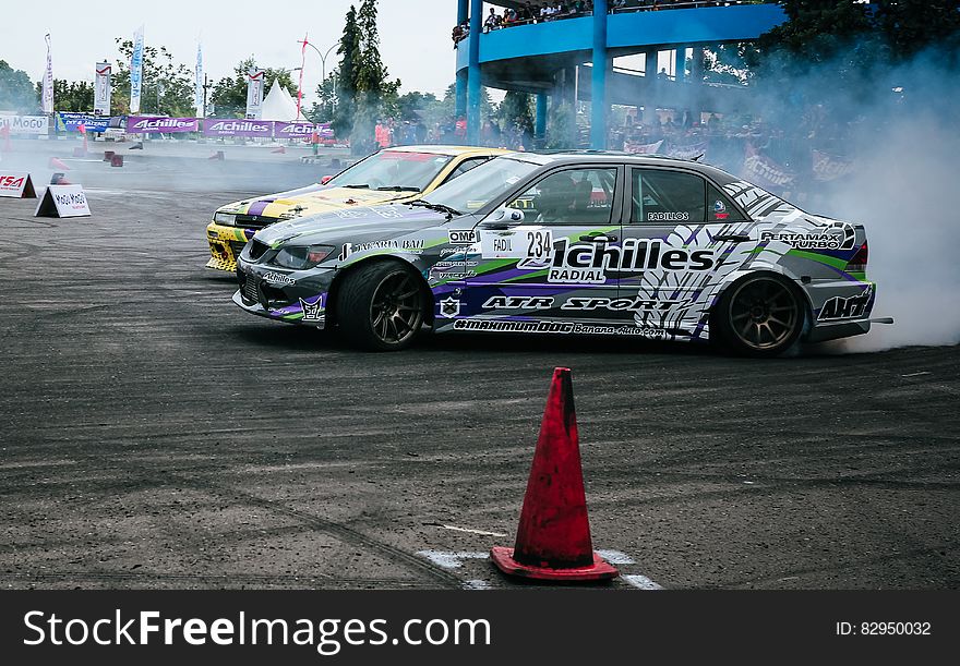 Gray And White Racing Car Drifting