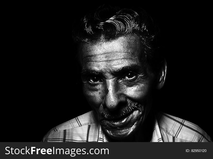Grayscale Photo of Man Smiling
