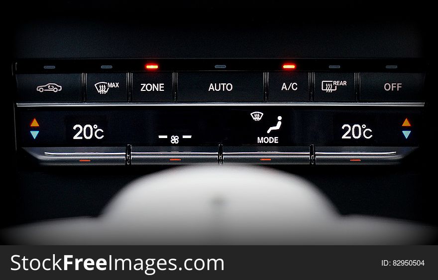 Close up of temperature controls on dash of modern automobile. Close up of temperature controls on dash of modern automobile.