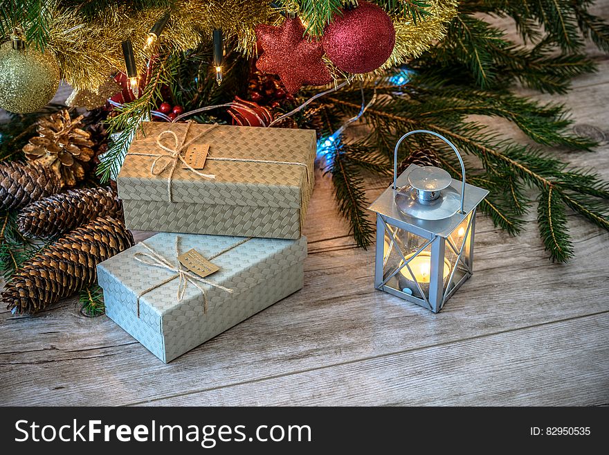 Christmas gifts under a tree.