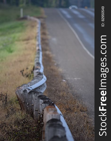 Wooden Small Fences Along The Road