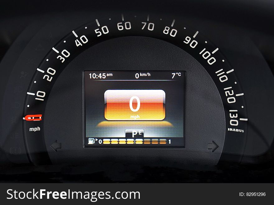 Digital and analog speedometer on automotive dashboard. Digital and analog speedometer on automotive dashboard.