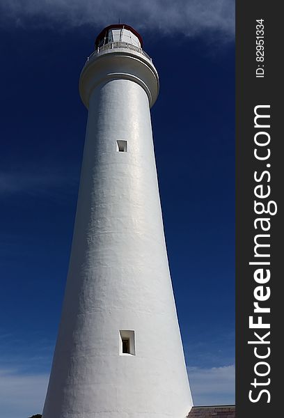 White Lighthouse in Low Angle Photography