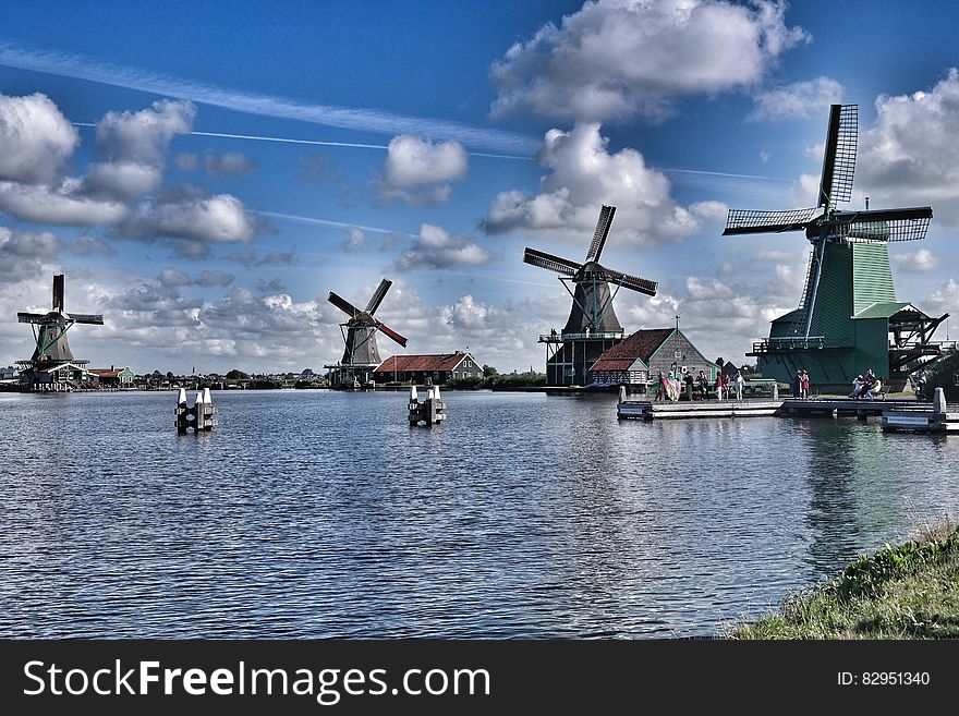 Wooden Windmills Near Lake