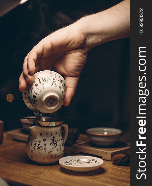 White Ceramic Saucer on Brown Wooden Table