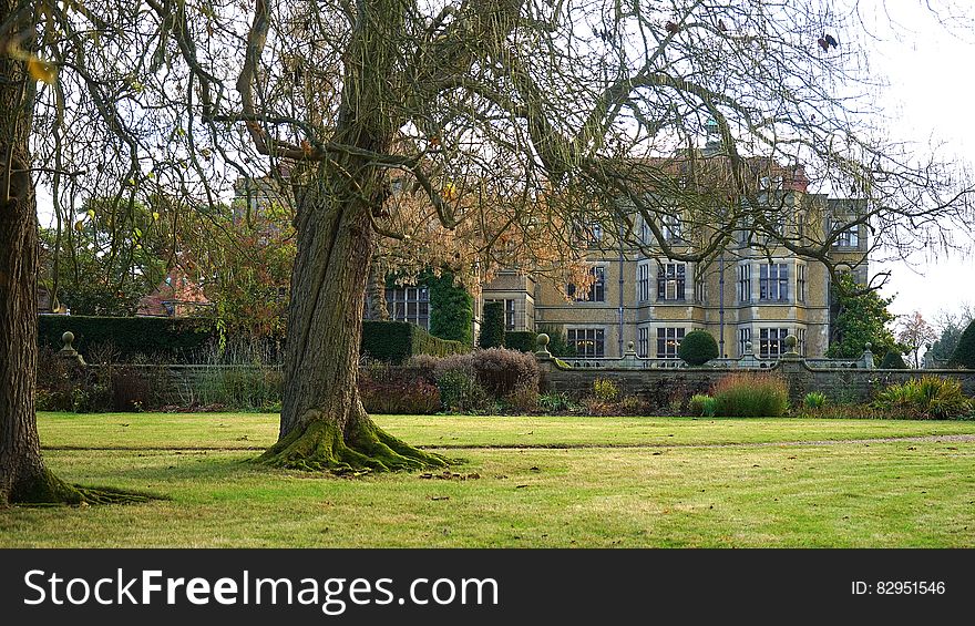 Large historic stone built mansion with bay windows on three floors and with walled garden and surrounded by parkland with well established trees. Large historic stone built mansion with bay windows on three floors and with walled garden and surrounded by parkland with well established trees.