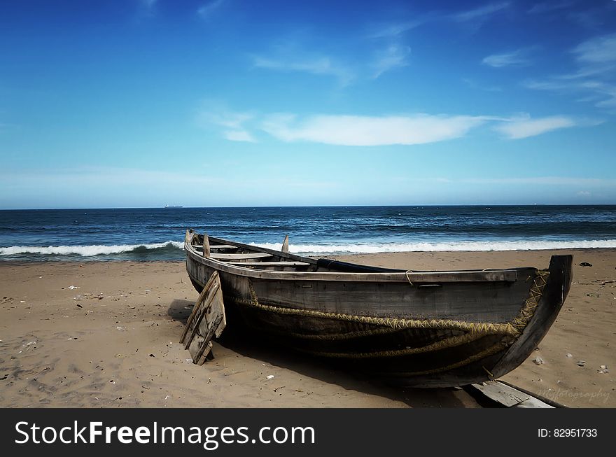 Wooden Boat On Beach