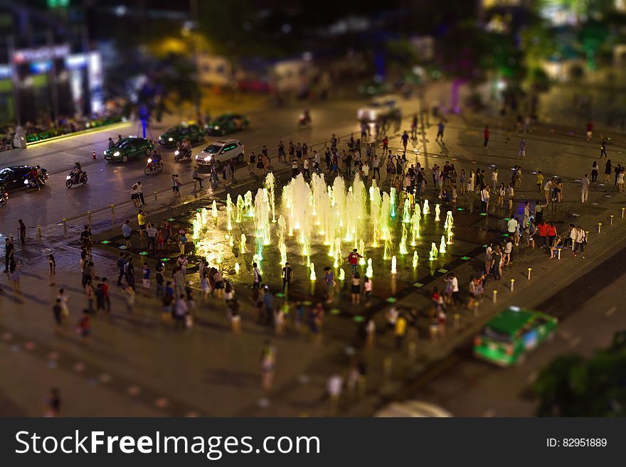 Fountain Surrounded by People during Nighttime