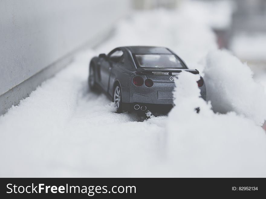 Close-up Photo of Toy Car on Snow