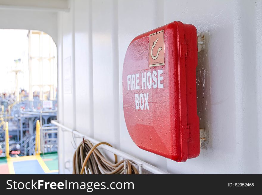 Close up of fire hose box mounted on wall.