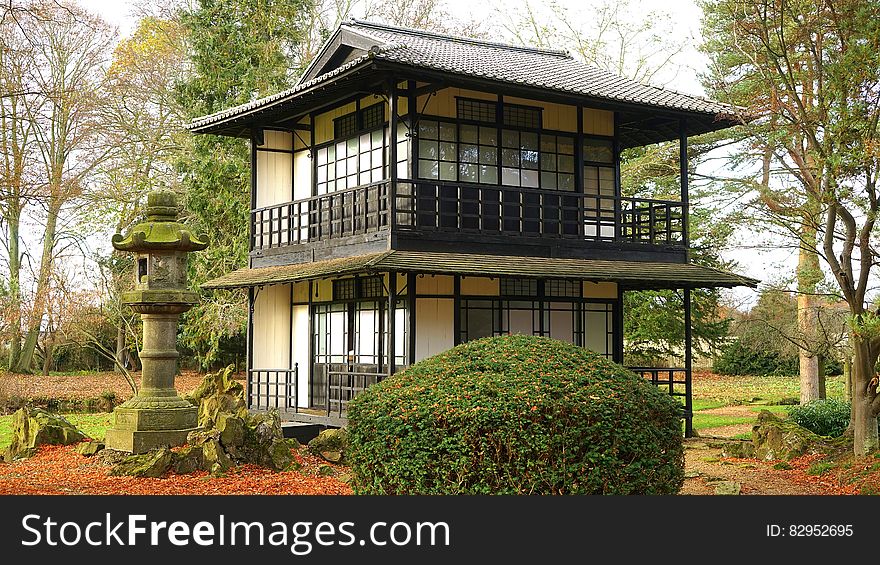 Exterior of small pagoda in Japanese garden on sunny day. Exterior of small pagoda in Japanese garden on sunny day.