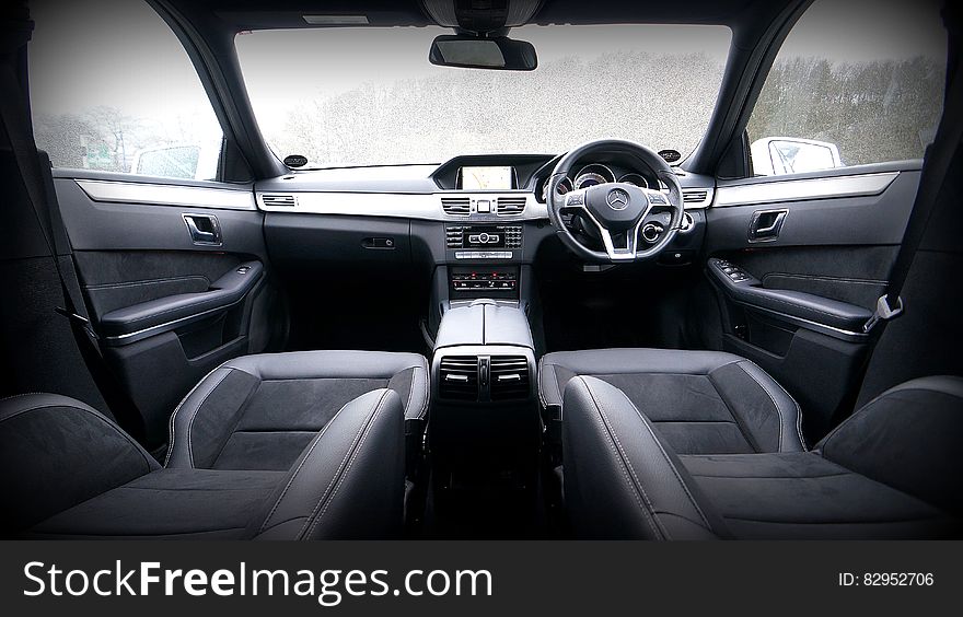 Interior seats and dashboard of luxury Mercedes Benz sedan. Interior seats and dashboard of luxury Mercedes Benz sedan.