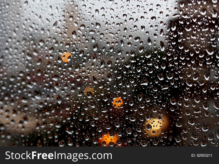 Full Frame Shot of Raindrops on Glass Window