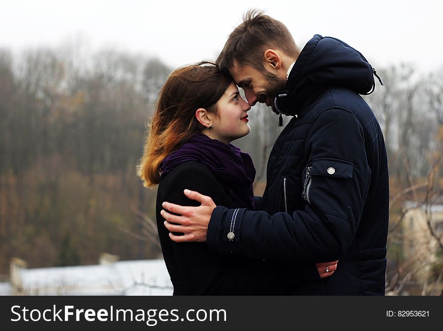 Young Couple on Woman during Winter