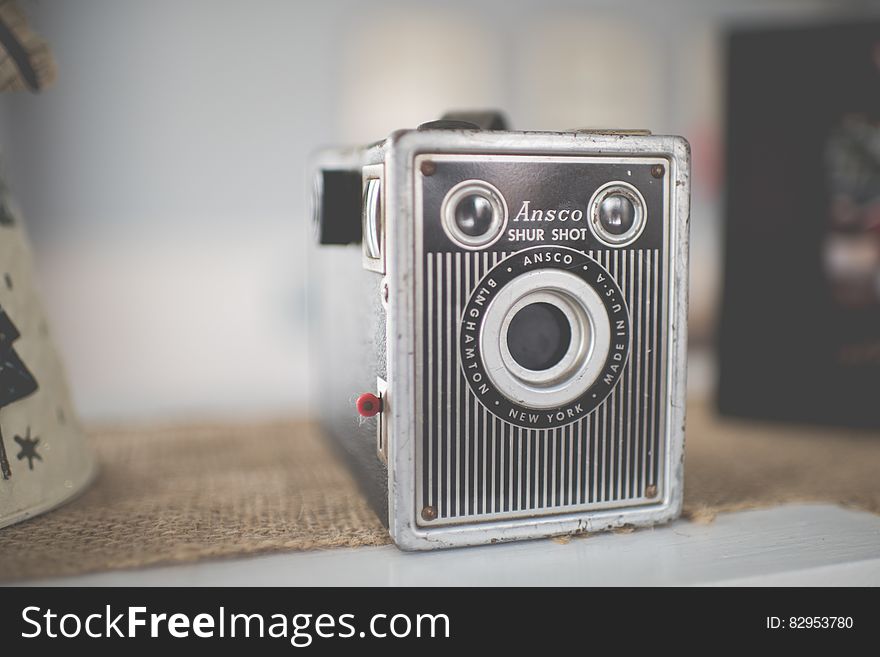 Vintage Ansco Shur Shot camera on burlap cloth.