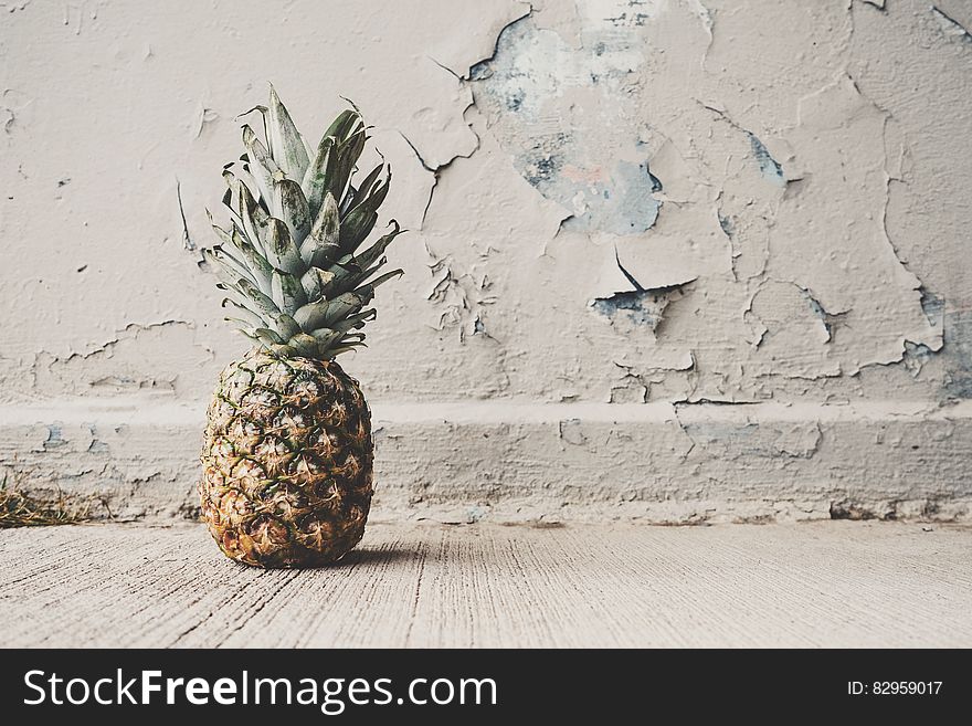 Pineapple Beside Concrete Wall