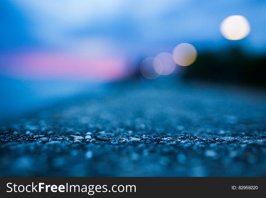 Shallow Focus Photography Of Gray Asphalt Floor