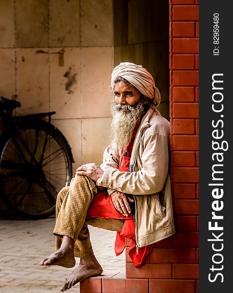 Man In White Kafiyeh Sitting