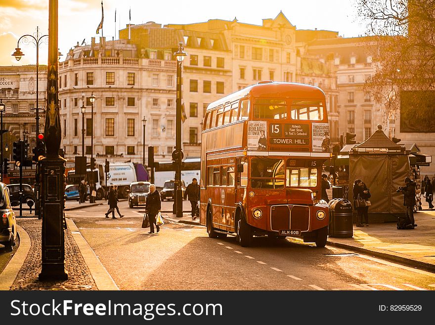 Red Double Decker Bus On Street Near People