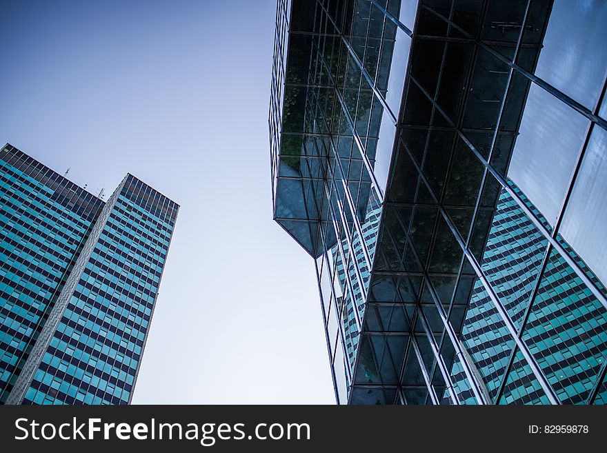 Facade of modern architecture against blue skies on sunny day.