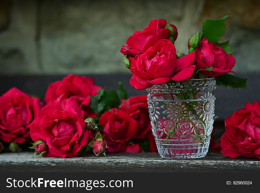 3 Red Rose on Glass Container