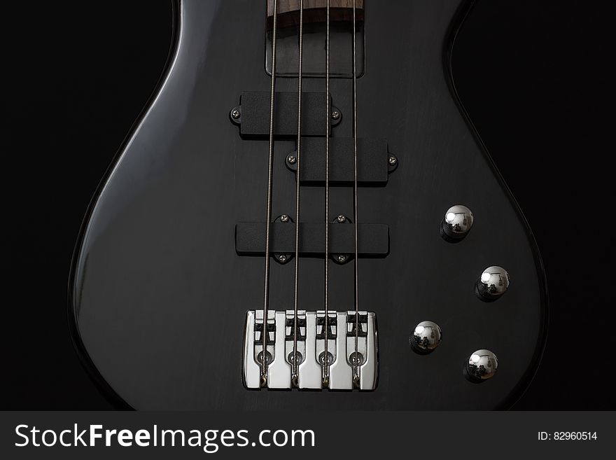 Black 4 Stringed Guitar