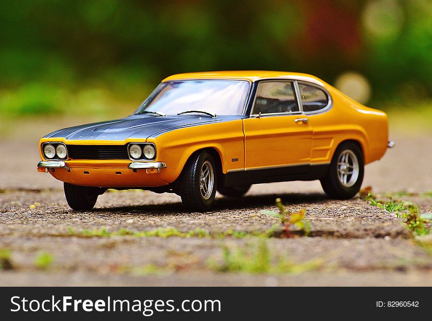 Yellow and Black Muscle Car in Tilt Shift Photography